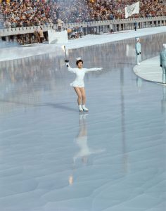 Sapporo 1972 Winter OG, Opening Ceremony - Izumi TSUJIMURA skating through the ice rink carrying the Olympic torch.