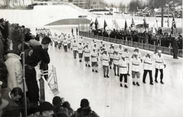 From the Lake Placid Olympic Museum’s Collection: Team USA entering the 1932 Opening Ceremony at the speed skating oval.